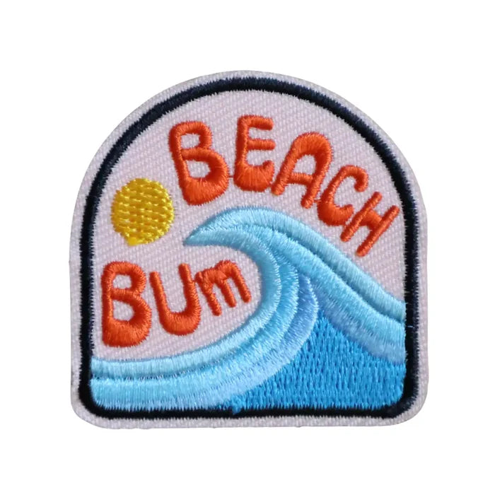 Embroidered Iron-on patch with 'Beach Bum' text, sun, and wave design on a white background