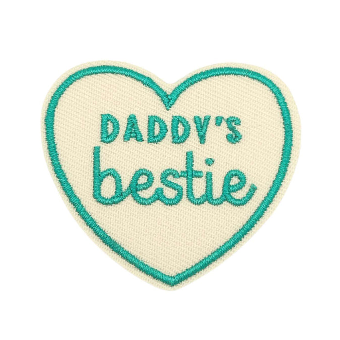 Heart-shaped patch with 'Daddy's bestie' text on a white background