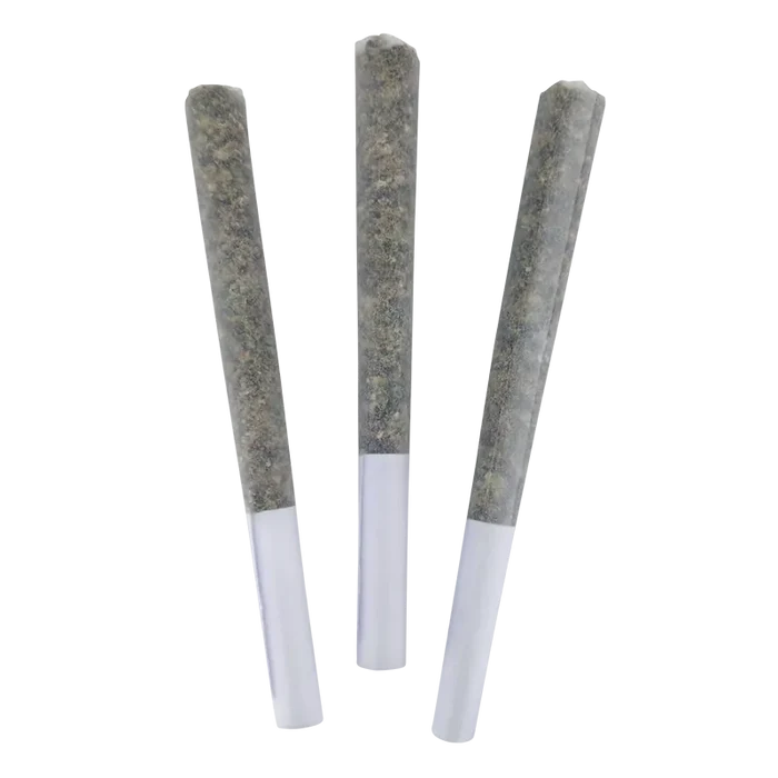 Three pre-rolled joints photographed upright against a white background, showing the paper tips and packed herb of the Roll-X.